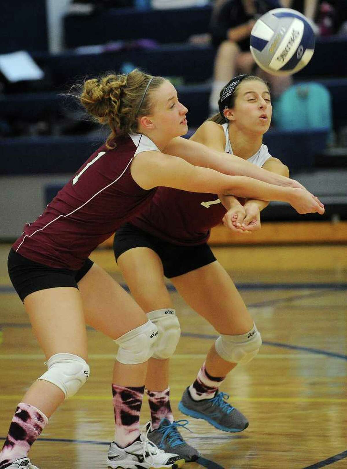 Bethel's Nicole Cibu, left, and Brooke Ferraro converge on the ball during their match at Weston High School on Monday, September 19, 2011.