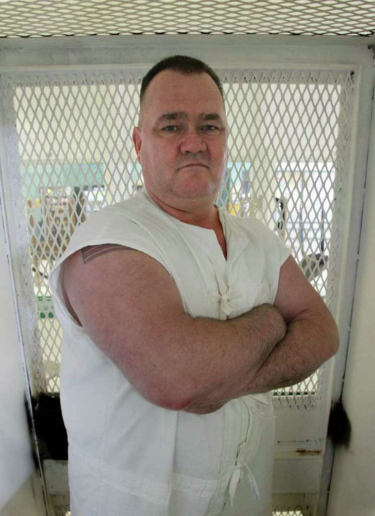 FILE - Texas death row inmate Cleve Foster poses for a picture at the Polunsky Unit in Livingston, Texas on March 30, 2011. Condemned inmate Cleve Foster already has been spared twice this year from the Texas death chamber and says he's not concerned another execution date is looming this week. The 47-year-old Foster is set to die Tuesday, Sept. 20, 2011 in Huntsville for the rape-slaying of a woman in Fort Worth nearly a decade ago. (AP Photo/Star-Telegram, Ron T. Ennis)