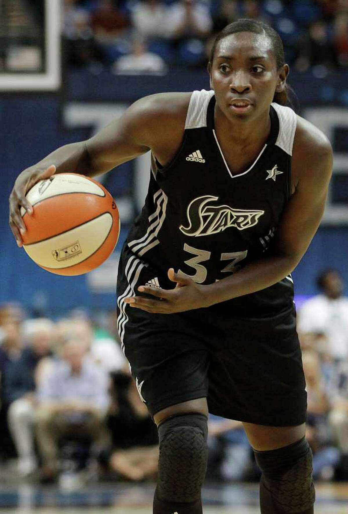 San Antonio Silver Stars forward Sophia Young (33) looks to make a pass against the Minnesota Lynx in the first half of Game 3 of a first-round WNBA playoff basketball series, Tuesday, Sept. 20, 2011, in Minneapolis. The Lynx won 85-67.