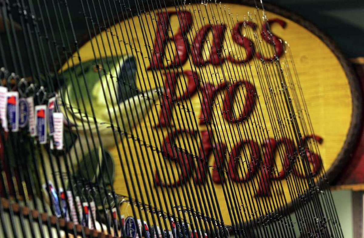 A display of rods is framed by the Bass Pro Shops.