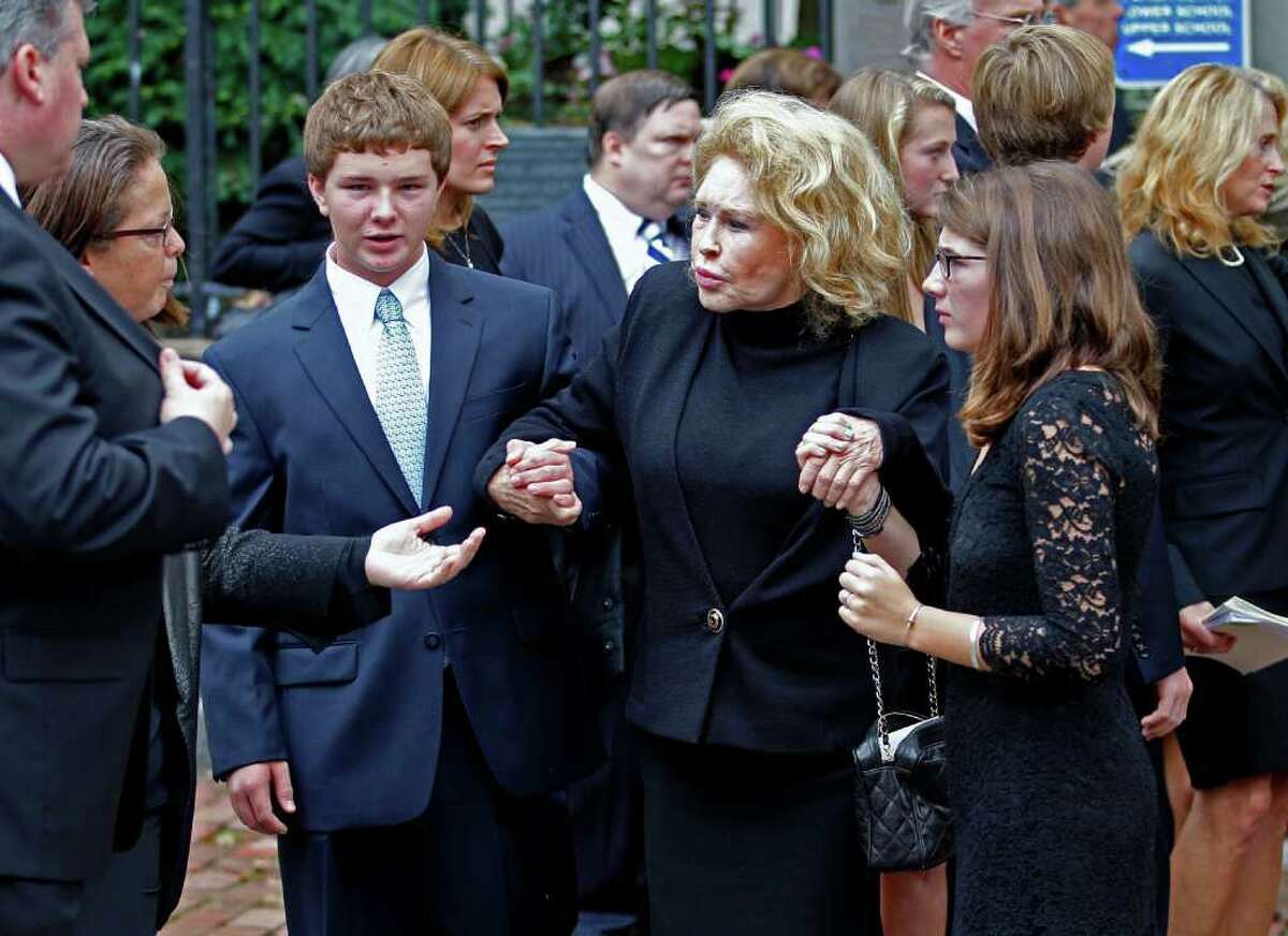Grace and Max Kennedy hold hands with Joan Kennedy as the leave Holy Trinity Church in Washington Wednesday, Sept. 21, 2011, after funeral services for Kara Kennedy. Kara Kennedy died Friday after a workout at a Washington health club. (AP Photo/Jose Luis Magana)