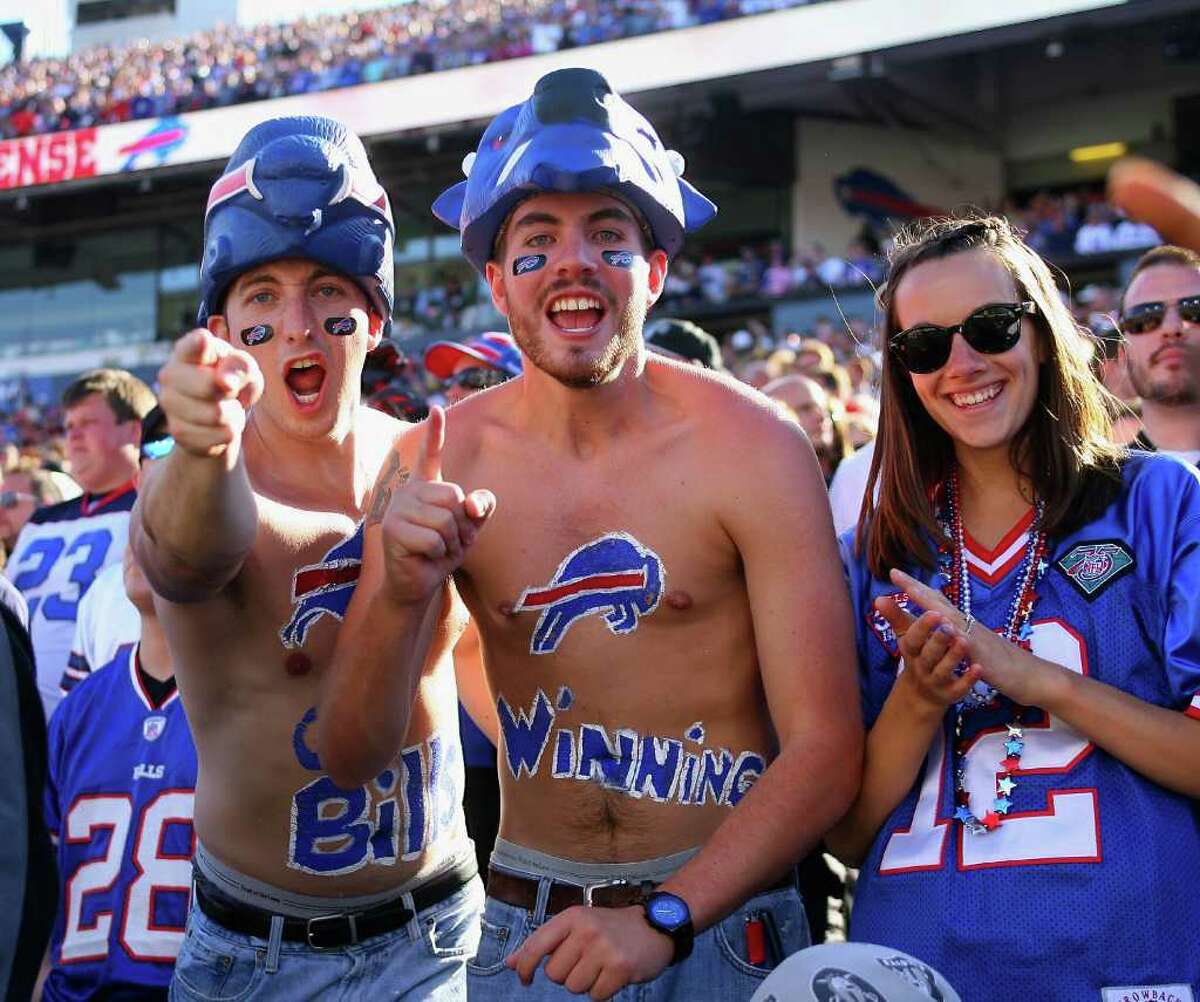 ORCHARD PARK, NY - SEPTEMBER 18: Fans of the Buffalo Bills celebrate after the Bills scored the game winning touchdown against the Oakland Raiders at Ralph Wilson Stadium on September 18, 2011 in Orchard Park, New York. Buffalo won 38-35. (Photo by Rick Stewart/Getty Images)