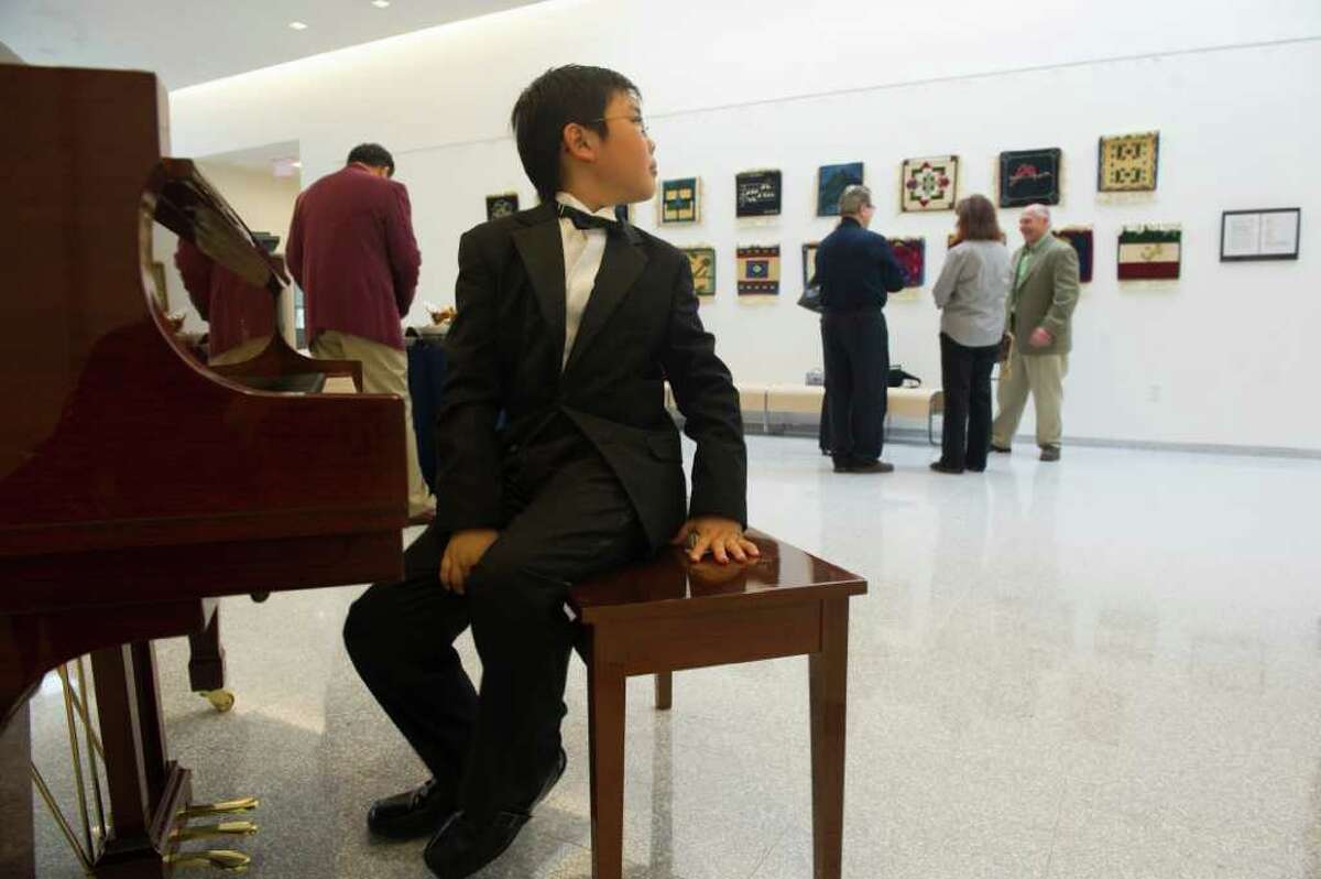Sean Yu, 11, breaks from performing Bach during the grand opening of King's 3,500 square foot Performing Arts Center at King in Stamford, Conn., Sept. 21, 2011. The theater features 454 seats, an orchestra pit, band room, choir room and rehearsal room.
