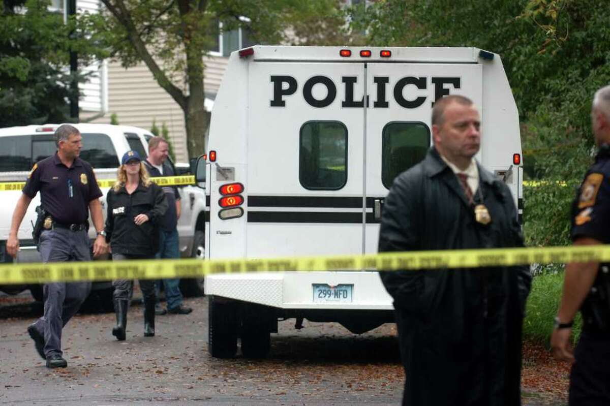 Milford Police officers on the scene at Branca Court on Friday, Sept. 23rd, 2011, where two bodies were found in a single family home, the result of a possible murder-suicide.