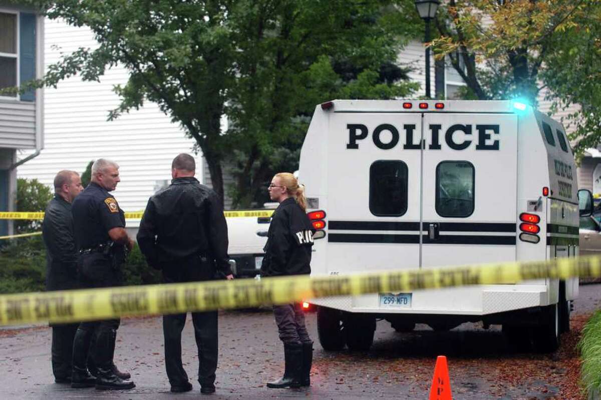 Milford Police officers on the scene at Branca Court on Friday, Sept. 23rd, 2011, where two bodies were found in a single family home, the result of a possible murder-suicide.
