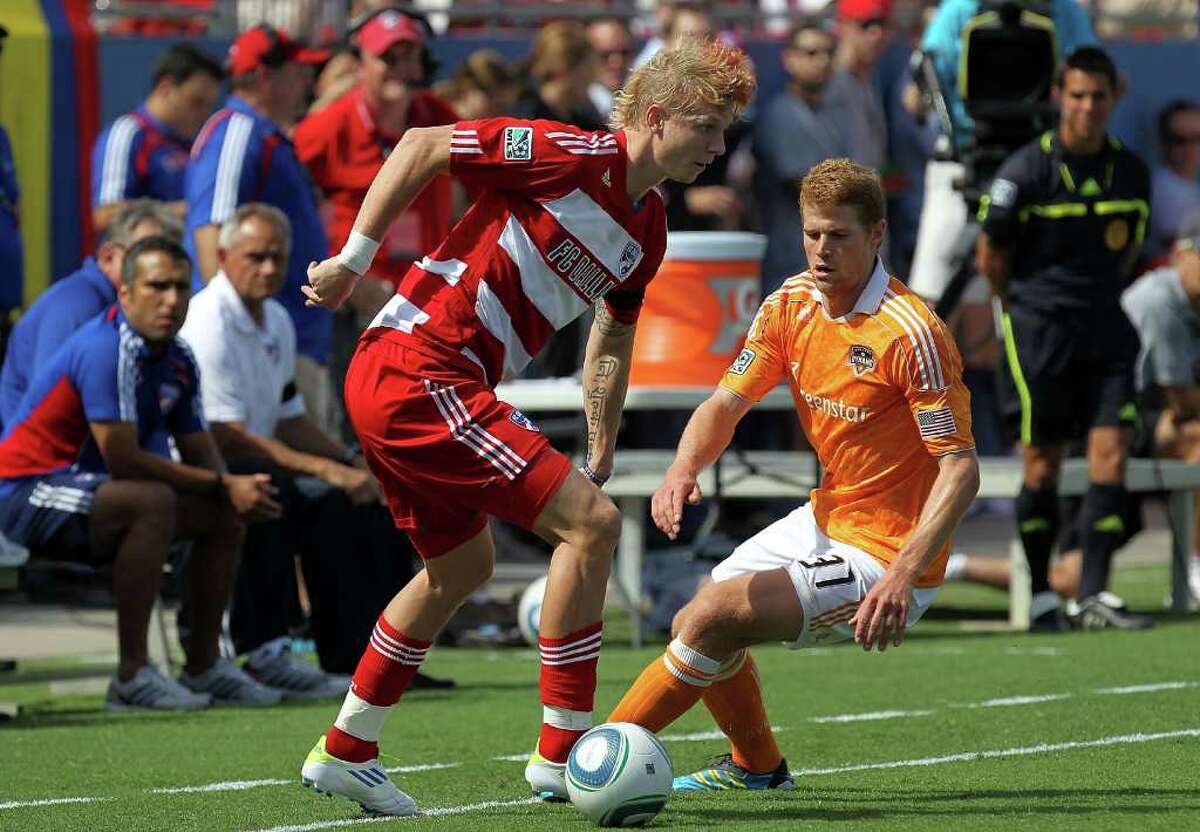 FRISCO, TX - SEPTEMBER 24: Brek Shea #20 of FC Dallas dribbles the ball against Andre Hainault #31 of the Houston Dynamo at Pizza Hut Park on September 24, 2011 in Frisco, Texas.