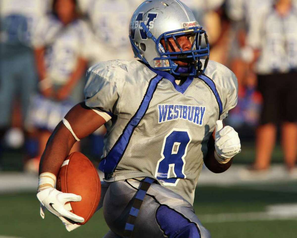 9/24/11: Halfback Jailin Singleton #9 of the Westbury Rebels rushes against the Westside Wolves of in a District 20-5A high school football game at Butler Stadium in Houston, Texas.: Thomas B. Shea