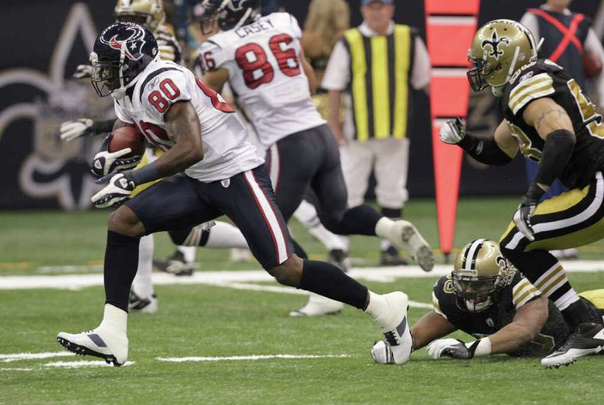 Houston Texans wide receiver Andre Johnson (80) runs against a New Orleans Saints defense during the first half of an NFL football game, Sunday, Sept. 25, 2011, in New Orleans. (AP Photo/Gerald Herbert)