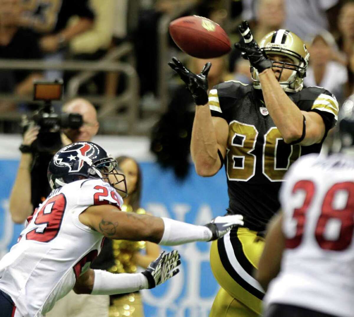 New Orleans Saints tight end Jimmy Graham (80) beats Houston Texans strong safety Glover Quin (29) for a 27-yard touchdown reception during the fourth quarter of an NFL football game at the Louisiana Superdome Sunday, Sept. 25, 2011, New Orleans. The Saints beat the Texans 40-33.
