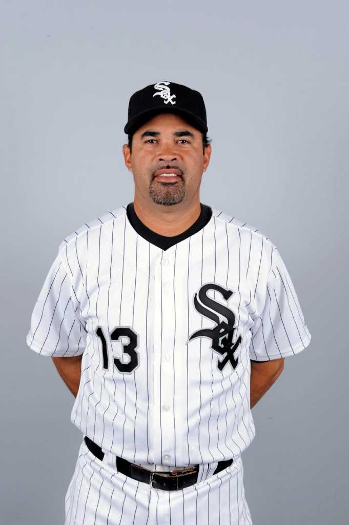 Chicago White Sox manager Ozzie Guillen, left, gets his 2005 World Series  Championship ring from chairman Jerry Reinsdorf before the game against the  Cleveland Indians on April 4, 2006, in Chicago. (UPI