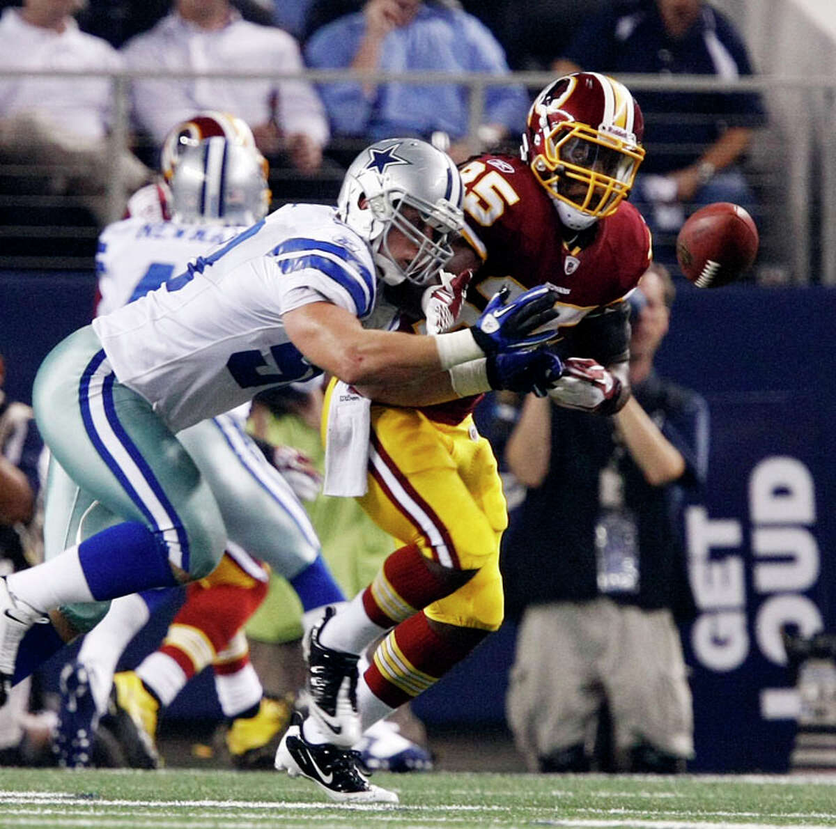 Dallas Cowboys inside linebacker Sean Lee (50) deflects a pass intended for Washington Redskins running back Tim Hightower (25) during the first half of an NFL football game Monday, Sept. 26, 2011, in Arlington.