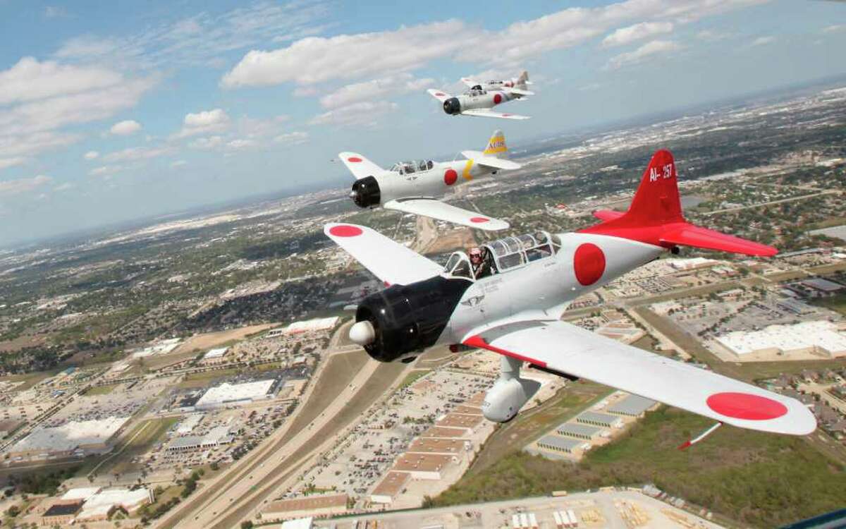 Members of the flight crew Tora Tora Tora fly replica American Zero airplanes near Ellington Airport Tuesday, Sept. 27, 2011, in Houston. The crew will be at Ellington Field along with other pilots for the upcoming Wings Over Houston Airshow on October 15th. (Cody Duty / Houston Chronicle )