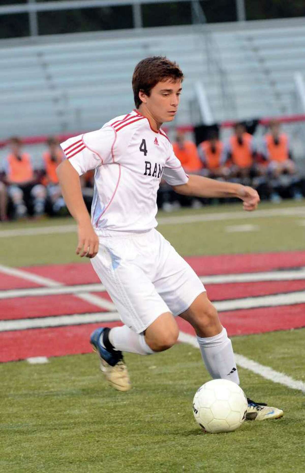 New Canaan's Robert Valente controls the ball during the boys soccer game against Fairfield Warde at New Canaan High School on Tuesday, Sept. 27, 2011.