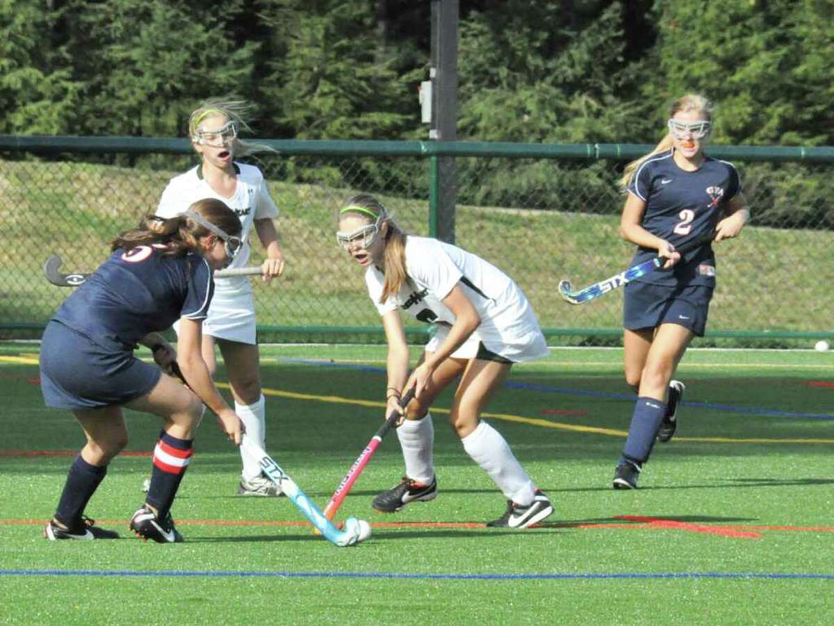 Greens Farms Academy junior captain Madison Leonard (Wesport) (left) looks to pass the ball to teammate Ashley Hutchison (Wesport) (right) in GFA's 2-0 loss to Convent of the Sacred Heart last week. Leonard and Hutchison played well defensively for the Dragons.