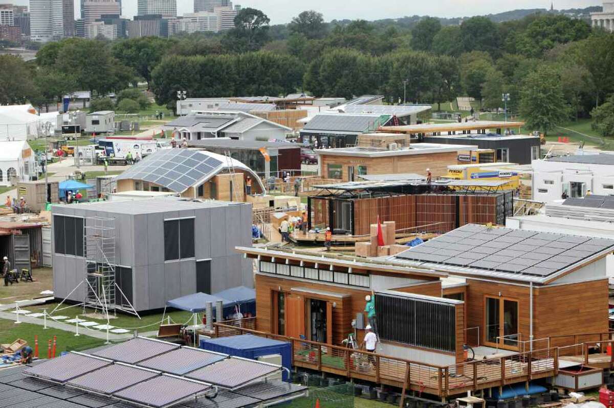 The U.S. Department of Energy Solar Decathlon challenges collegiate teams to design, build, and operate solar-powered houses that are cost-effective, energy-efficient, comfortable, healthy and attractive, harnessing the sun to produce at least as much energy and hot water as they consume. Teams and homes are rated or judged based on 10 categories: architecture, market appeal, engineering, communications, affordability, comfort zone, hot water, appliances, home entertainment and energy balance. The Department of Energy has hosted the contest every two years since 2002. The current Solar Decathlon runs through Oct. 2 in Washington, D.C. Here's an overview of teams working on their homes on Sept. 19, 2011, followed by pictures and descriptions of all of this year's entries.