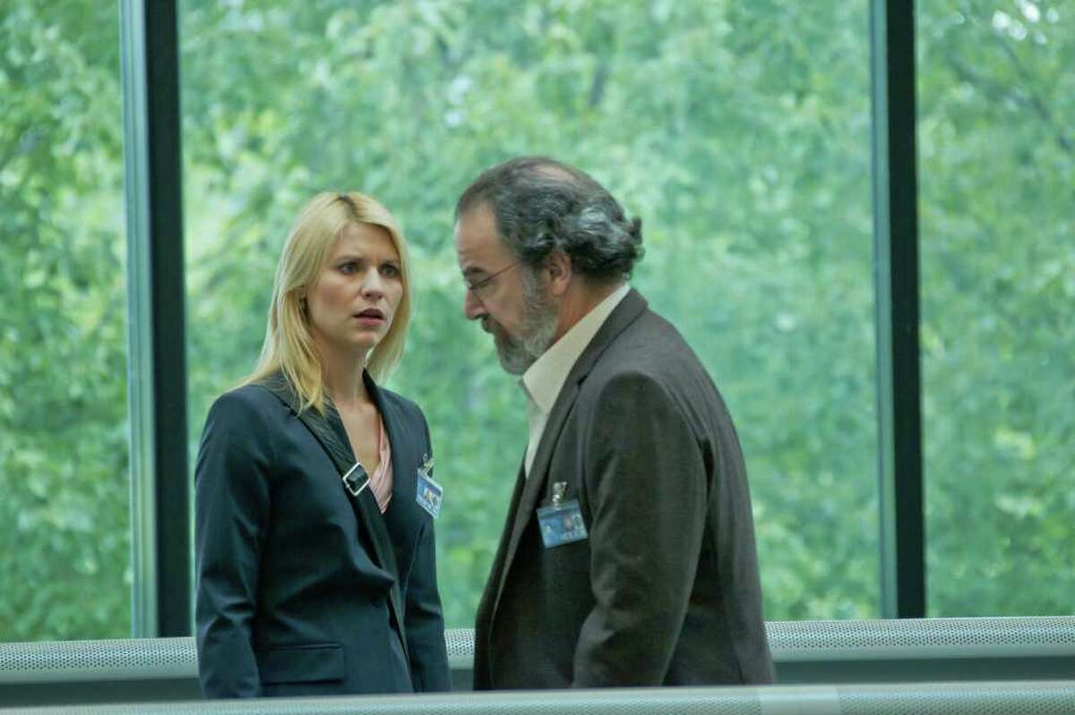 KENT SMITH : SHOWTIME SUSPICIONS: CIA agent Carrie Mathison (Claire Danes) finds an ally in Saul Berenson (Mandy Patinkin) in Homeland.