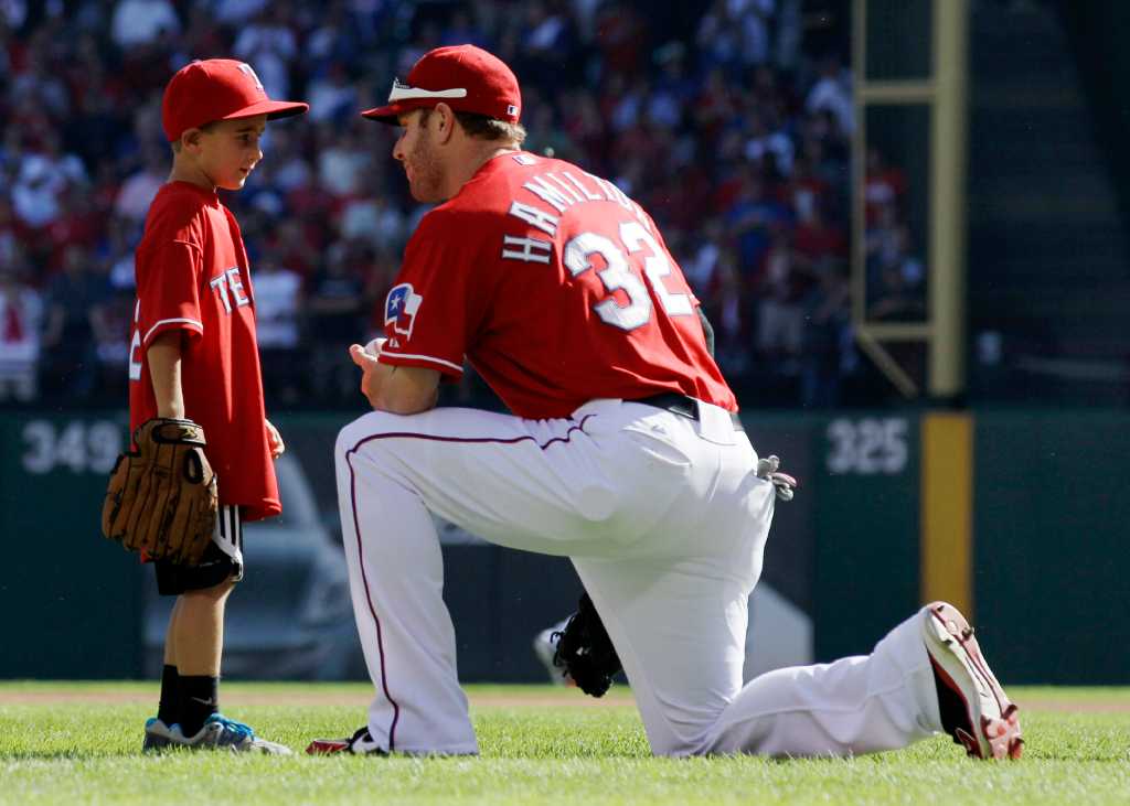 Fan whose father died at game throws out first pitch