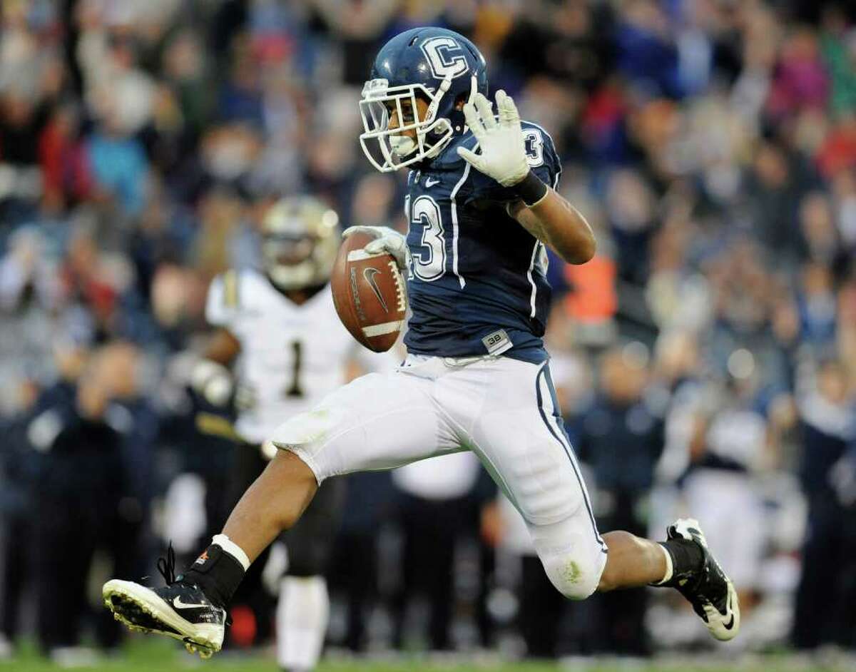 Connecticut's Lyle McCombs scores a touchdown against Western Michigan in the second half of an NCAA college football game, in East Hartford, Conn., on Saturday, Oct. 1, 2011.