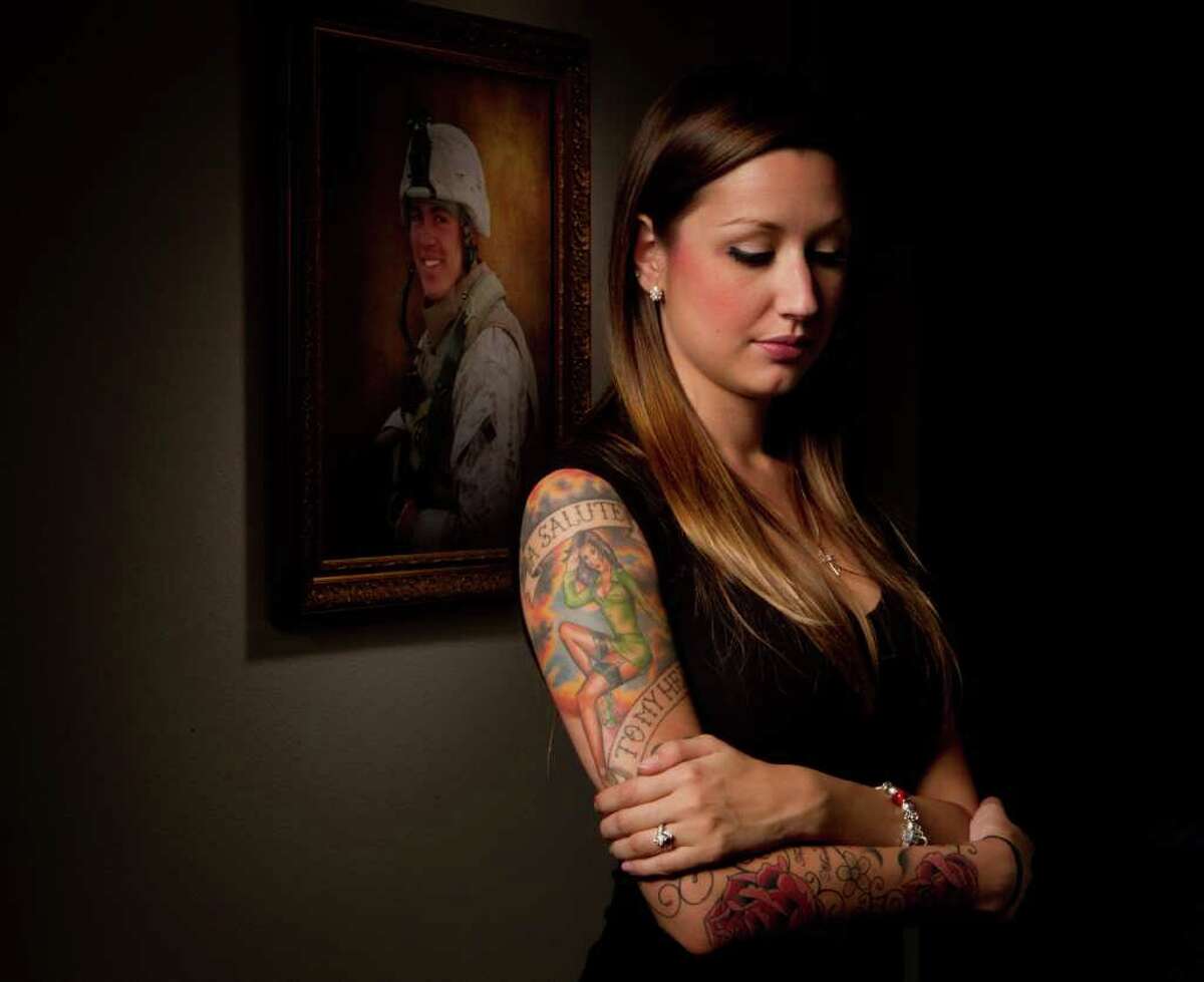 Billy Smith II : CHRONICLE CLOSE TO HER HEART: A portrait of Rachel Smith's late husband, Marine Staff Sgt. Jeremy Smith, who was killed in Afghanistan in April, hangs in her Fort Worth home. The tattoos on her arm are a tribute to their love and his life as a Marine.