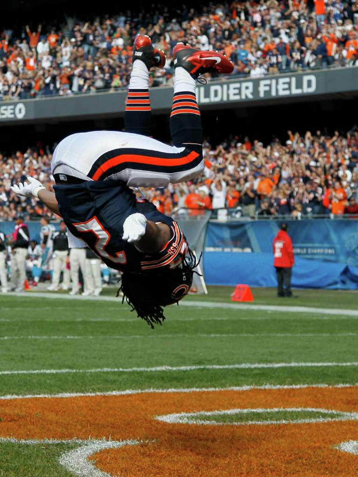 Chicago Bears running back Marion Barber (24) does a backflip