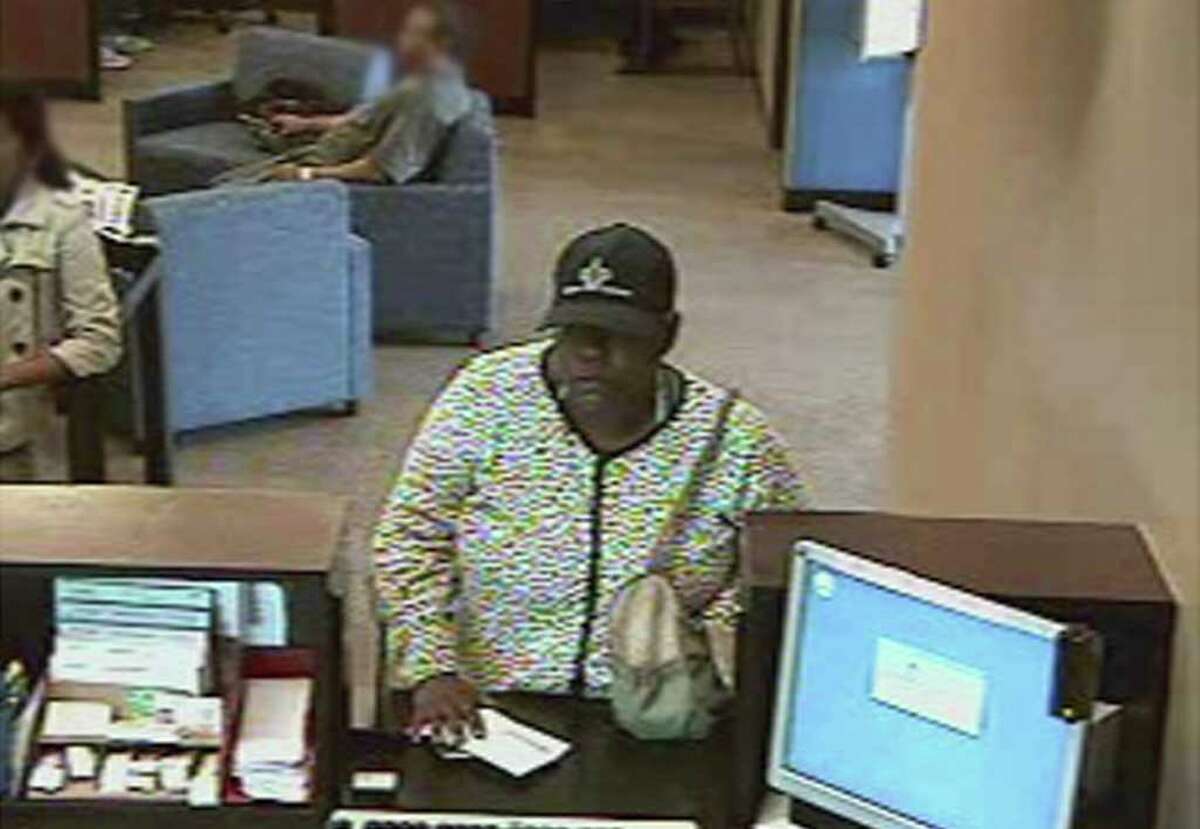 The FBI Bank Robbery Task Force needs your help identifying a woman dubbed the "Butterfingers Bandit" after robbing the J.P. Morgan Chase bank located at 12401 South Post Oak Road in Houston, Texas, earlier today. After robbing a teller, the woman turned to leave, dropped the cash and uttered an expletive, before picking the money back up again. The bank's surveillance equipment captured several pictures of the "Butterfingers Bandit" during the robbery. (credit FBI)