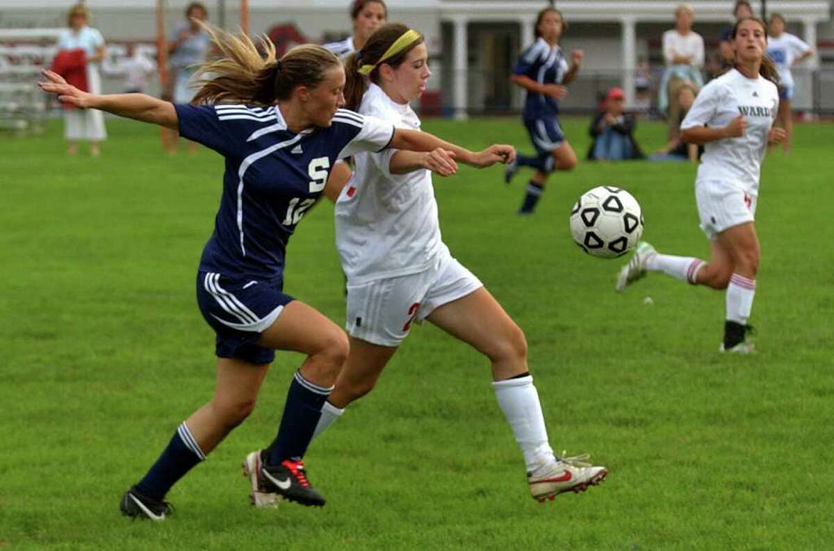 Staples' Turner Block, left, chases down the ball against Fairfield Warde Sept. 27. Block had the Lady Wreckers' only goal Monday in a 4-1 loss to Trumbull.
