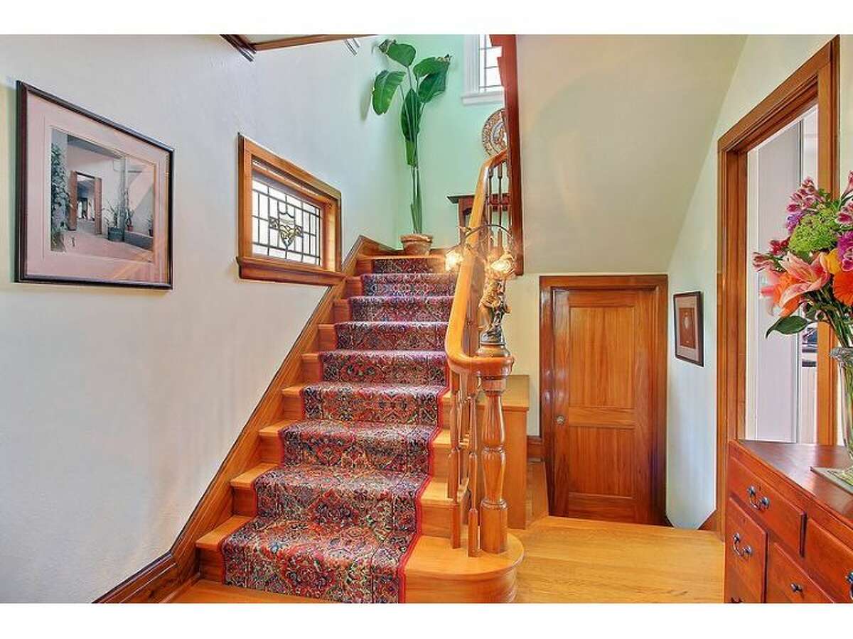 Stairway of 2802 10th Ave. E. The 3,450-square-foot brick Colonial, built in 1924, has three bedrooms and 3.25 bathrooms, tons of exposed wood, leaded glass, radiators, views, a wine cellar, a large deck and a 5,500-square-foot lot. It's listed for $1.295 million.