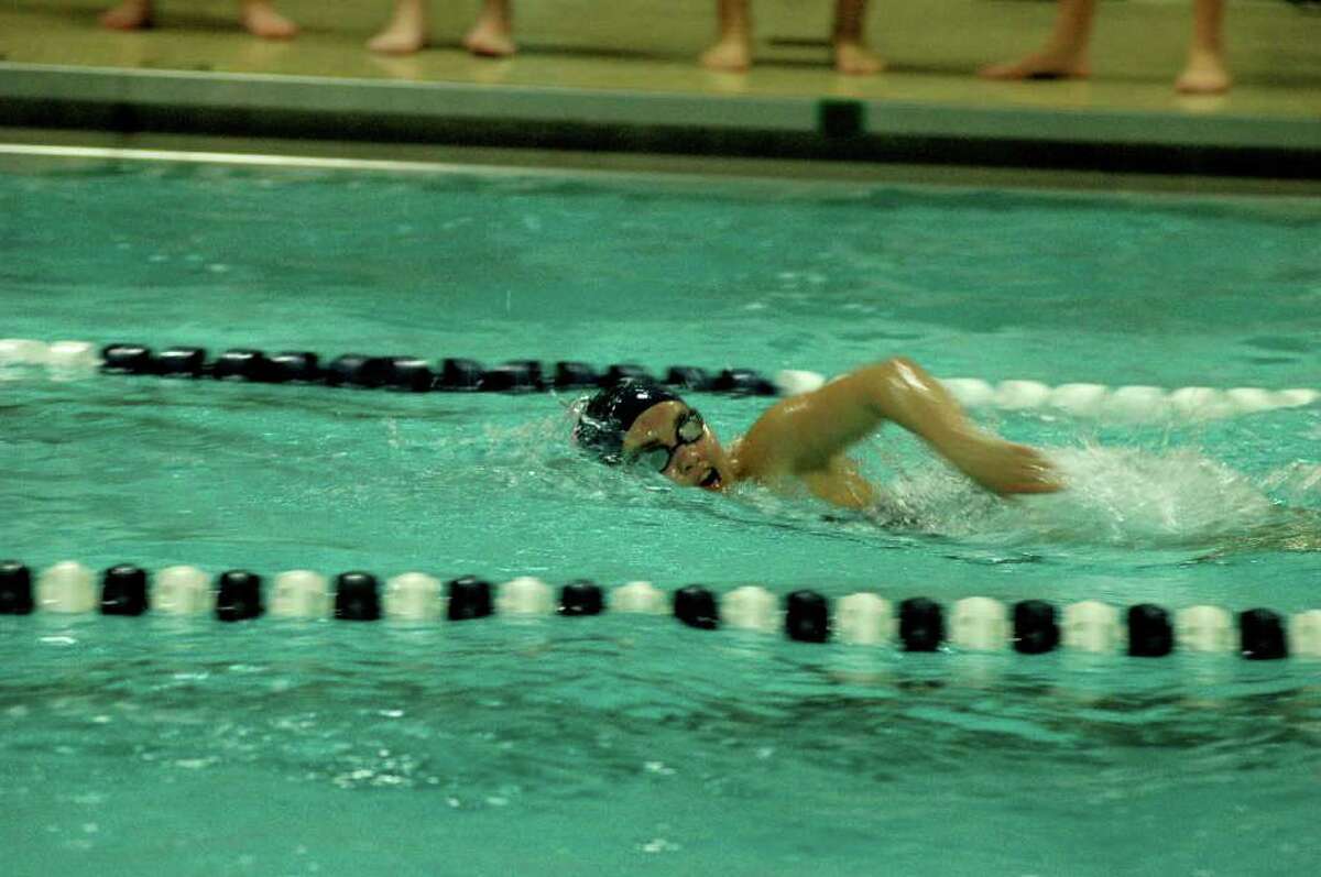 Staples' Gabby Wimer accelerates to victory in the 100-meter freestyle Friday in the Lady Wreckers' 101-80 triumph over Ridgefield.