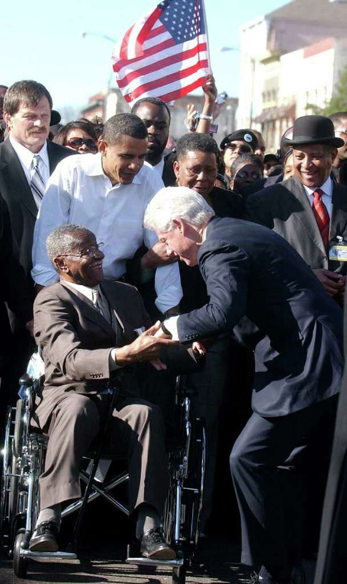 FILE - In a Sunday, March 4, 2007 file photo, Sen. Barack Obama, second from left, looks on as civil rights leader Fred Shuttlesworth, front left, greets former President Bill Clinton in Selma, Ala. The Rev. Fred Shuttlesworth, who was hailed by the Rev. Martin Luther King Jr. for his courage and energy, died Wednesday, Oct. 5, 2011 at the Birmingham, Ala. hospital. He was 89. (AP Photo/The Birmingham News, Linda Stelter) MAGS OUT; NO SALES