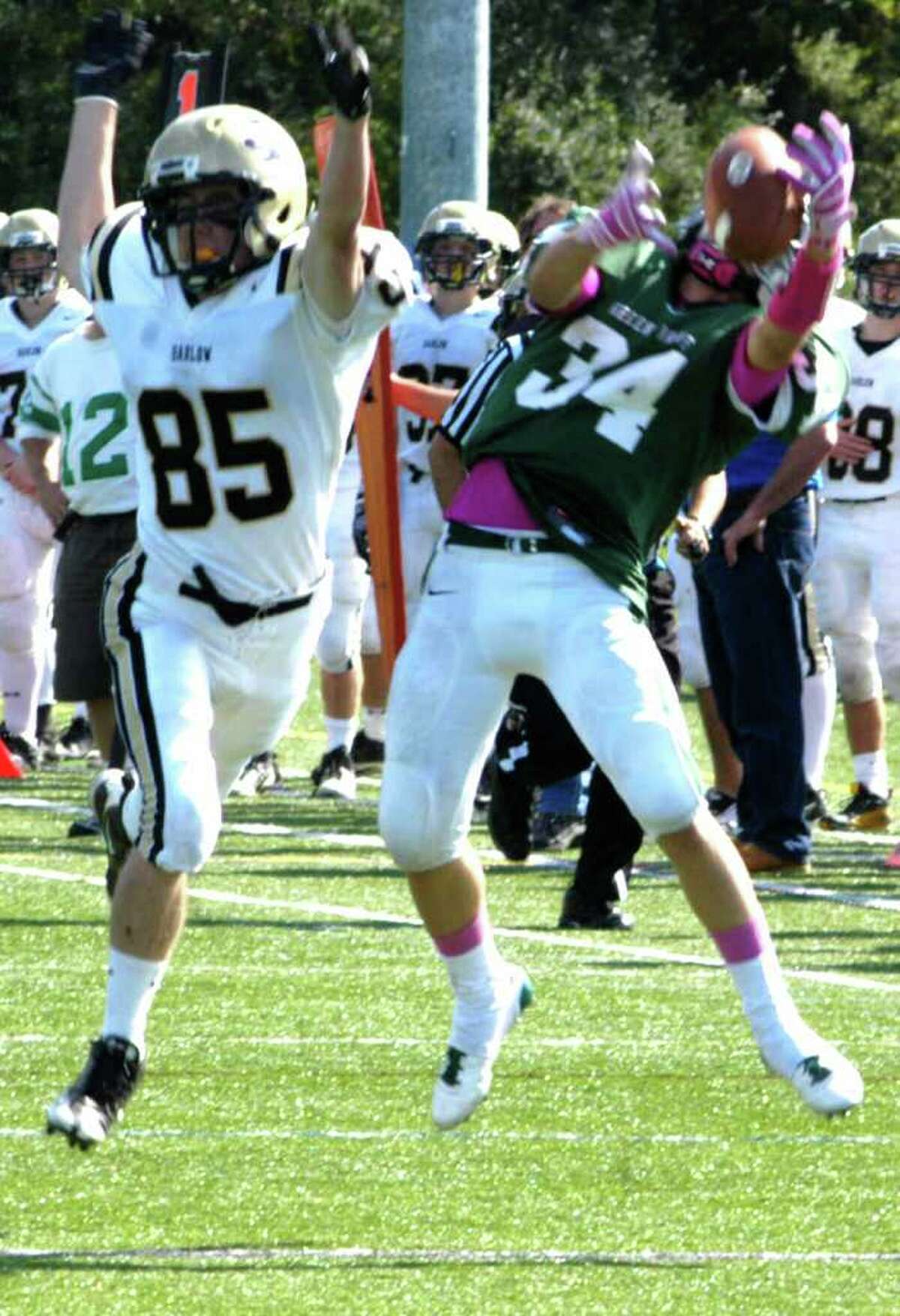 SPECTRUM/Green Wave junior Tevan Leonard makes a circus catch for the NMHS defense's fourth interception of the day as New Milford High School football scored its first victory of the 2011 campaign with a 28-9 'W' over Joel Barlow, Sunday, Oct. 2, 2011 in Brookfield.