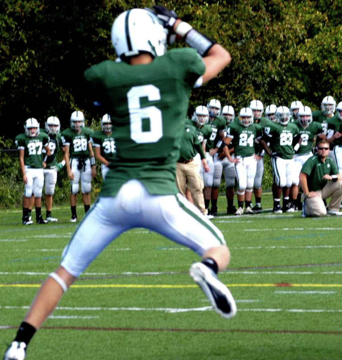 SPECTRUM/Green Wave junior Kameron Bradshaw hauls down one of his team's four interceptions as New Milford High School football rolls to a 28-9 victory over Joel Barlow, Sunday, Oct. 2, 2011 in Brookfield.