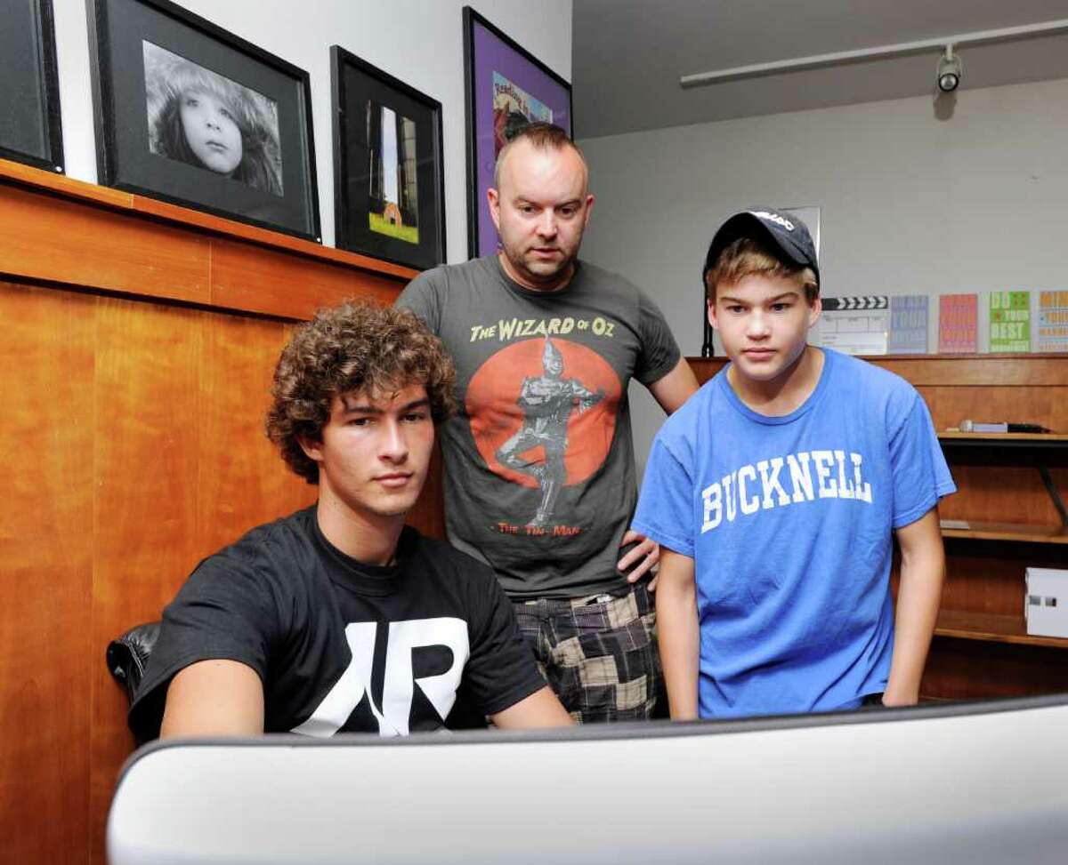 Felix Dostmann, 17, left, and Jack Benenson, 15, right, both Greenwich High School students, work on a computer project with the help of Arch Street Teen Center Director, Kyle Silver, at the Arch Street Teen Center in Greenwich Thursday, Aug. 25, 2011. The center is one of many local organizations that advocates against teen substance abuse and attempts to promote healthy drug-free choices and activities.