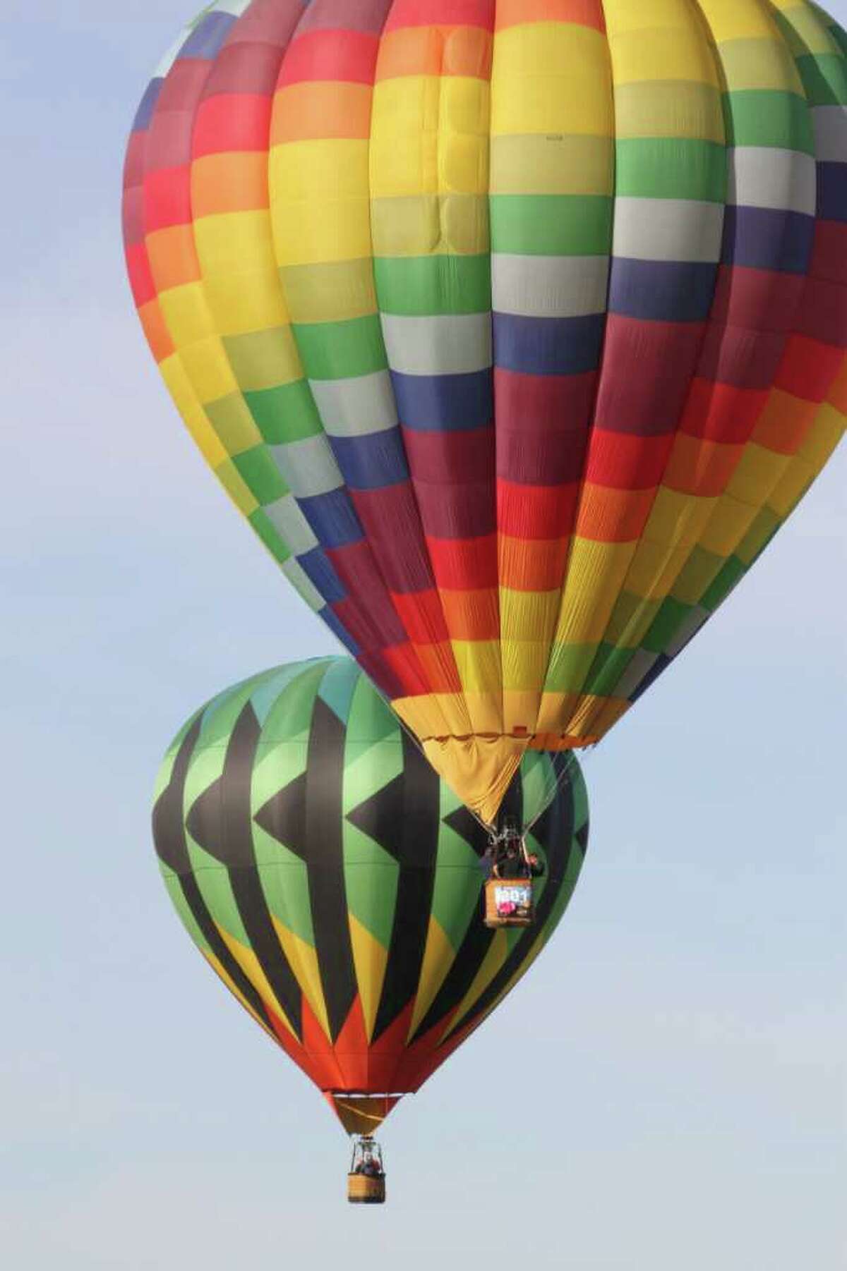 Hot air balloons float over the 40th Albuquerque International Balloon Fiesta in Albuquerque, N.M.