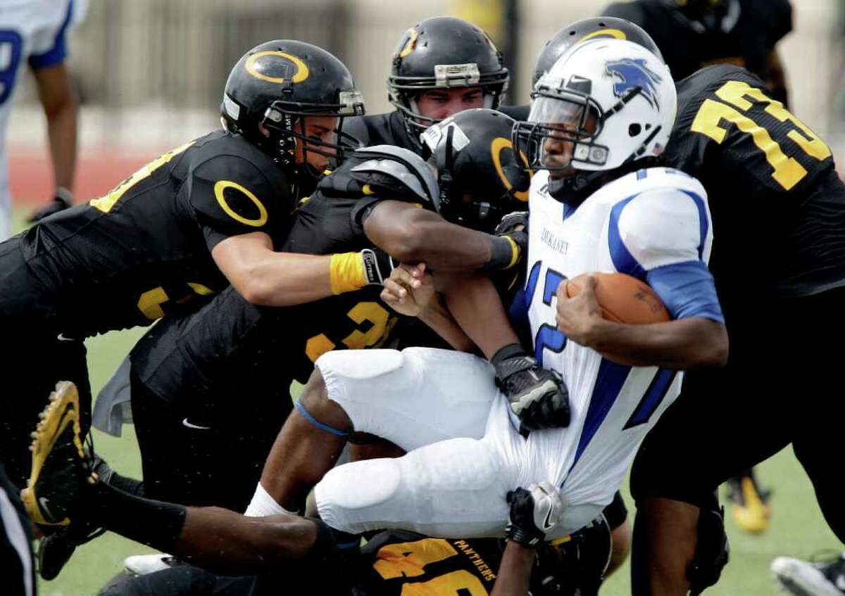 10/8/11: Quarterback D'Juan Hines #12 of the Dekaney Wildcats is tackled by the Klein Oak Panthers defense in a high school football game at Klein Memorial Stadium in Klein, Texas. For the Chronicle: Thomas B. Shea