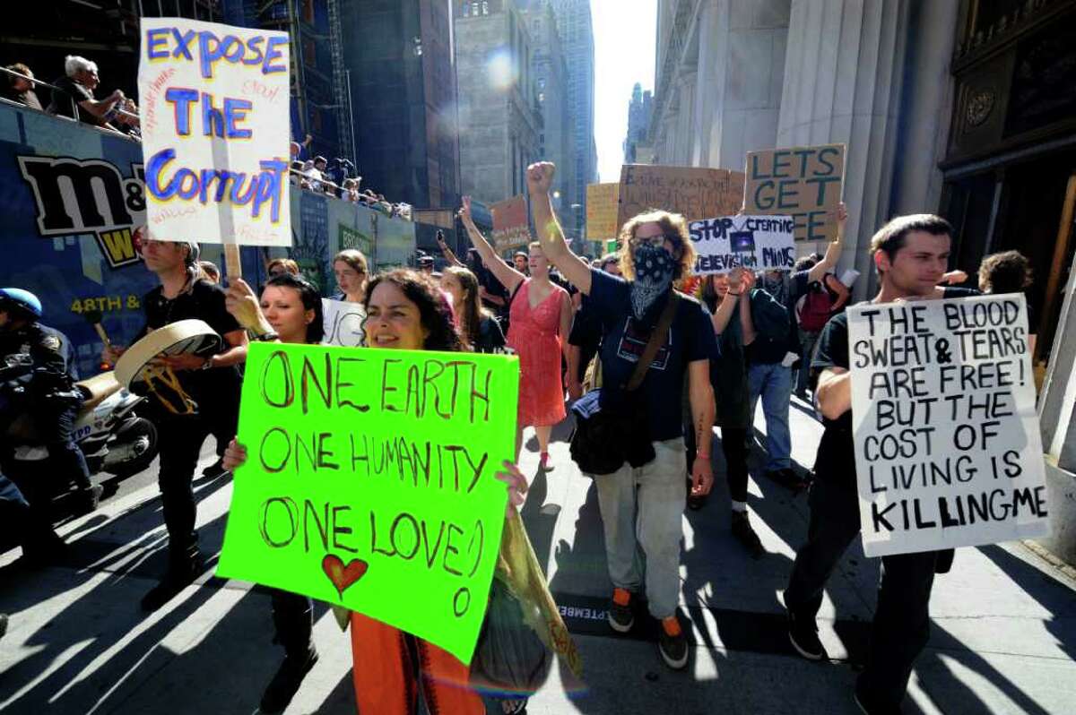 HENNY RAY ABRAMS : ASSOCIATED PRESS 'OCCUPATION' FORCE: Protesters with Occupy Wall Street march up Broadway in New York on Saturday. Although the protesters share a common point of view, there's a diversity of age, gender and race.
