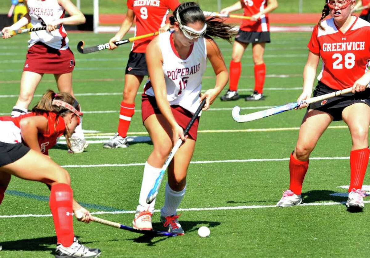 Pomperaug High School's #16 Jess Eisenbach moves the ball against Greenwich High School in a Field Hockey game in Southbury Monday, Oct. 10, 2011.
