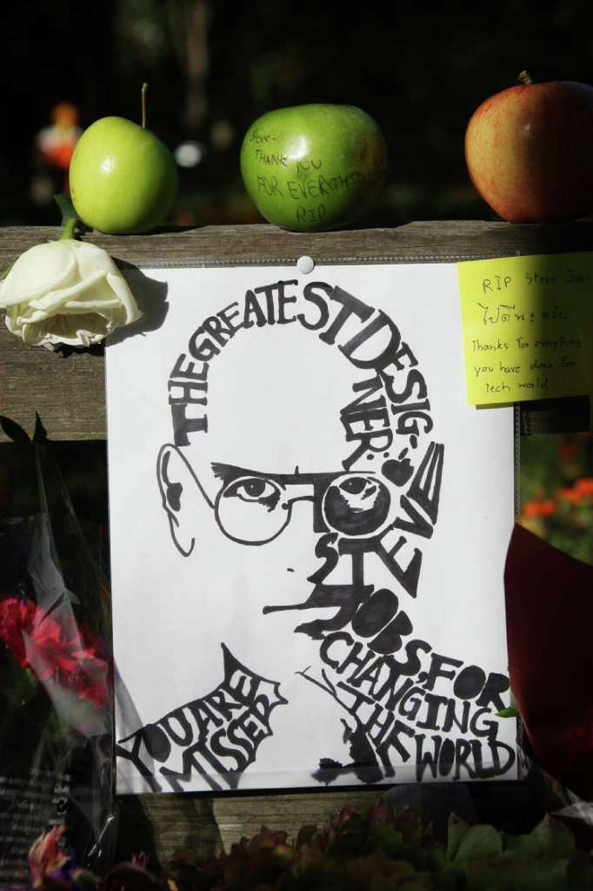JIM GENSHEIMER : SAN JOSE MERCURY NEWS REMEMBRANCE: This display was one of many tributes left in front of Steve Jobs' home in Palo Alto, Calif., by a steady stream of admirers.