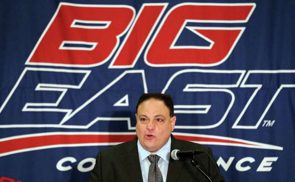 In this Aug. 2, 2011, file photo, Big East commissioner John Marinatto speaks to reporters during Big East NCAA college football media day in Newport, R.I. Big East football school officials will meet Tuesday night in New York City to discuss the league's future, and a Pac-12 official expects conference presidents in that league to decide by the end of the week if they want to expand again. (AP Photo/Stew Milne, File)
