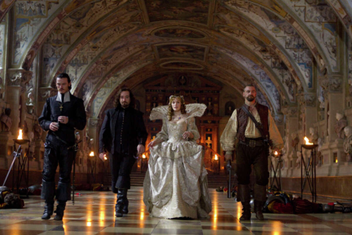 (L-R) Luke Evans as Aramis, Matthew Macfadyen as Athos, Milla Jovovich as Milady de Winter and Ray Stevenson as Porthos in "The Three Musketeers."