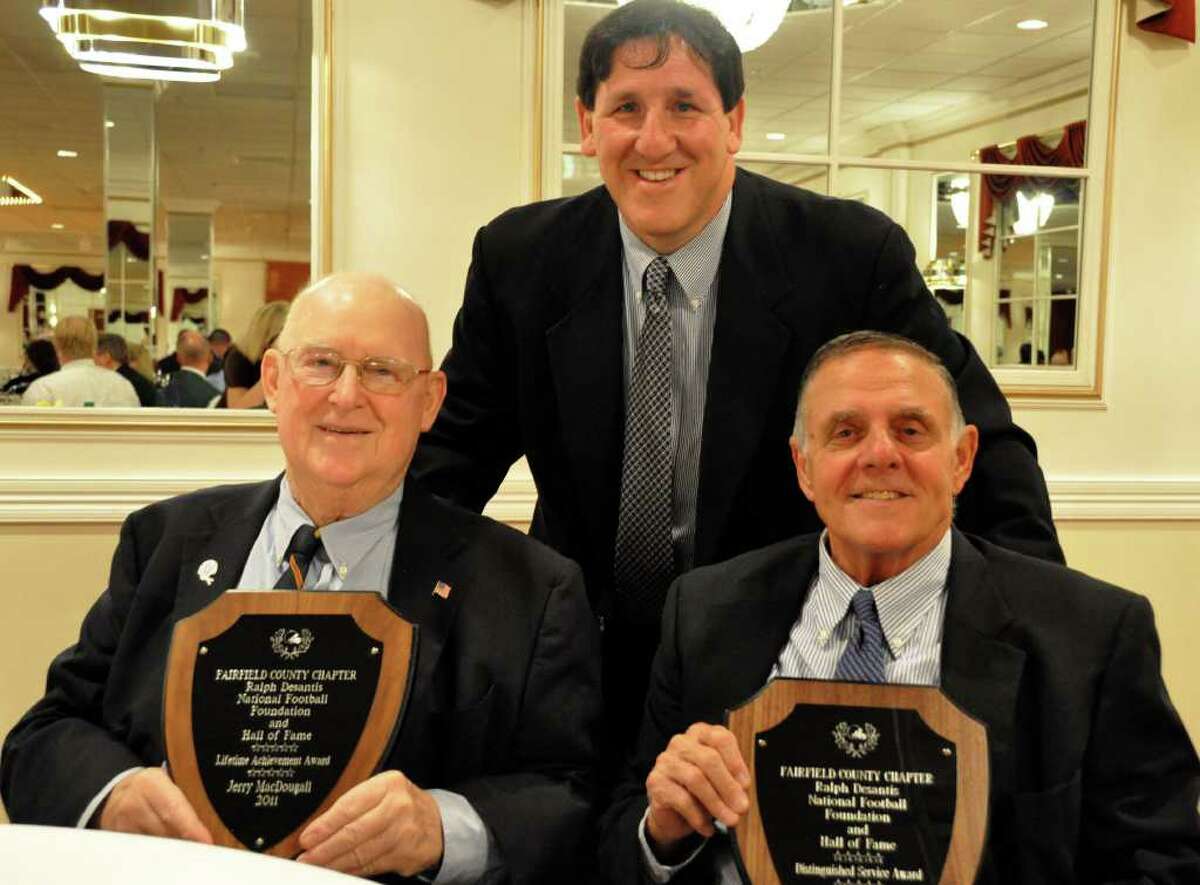 Jerry McDougall (left) poses with John Barbarotta (center) and Richard Whitcomb (right) at his last public appearance at the Ralph DeSantis Fairfield County Chapter of the National Football Foundation & College Hall of Fame scholar-athlete banquet on April 26, 2011. A legendary coach, McDougall died Oct. 11 at 75.