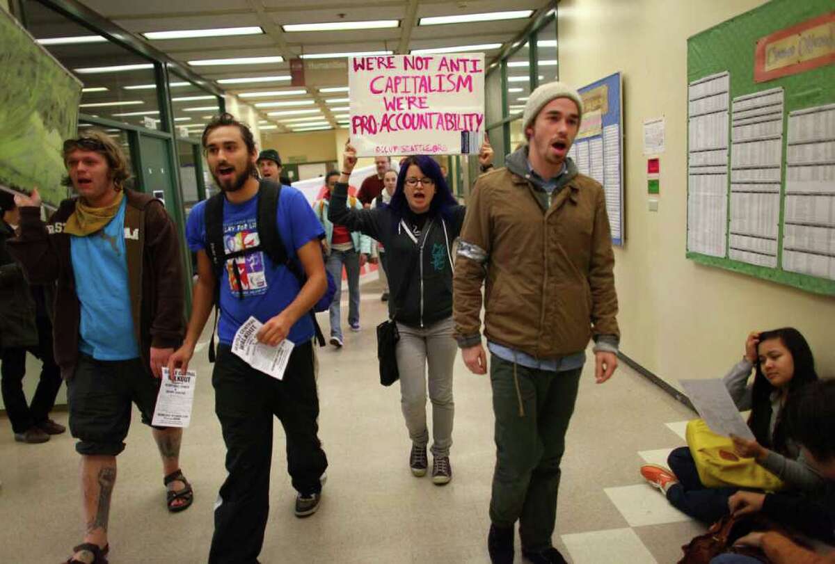 Students at Seattle Central Community College march through the school's hallways as students from area high schools and colleges walked out of classes and joined protesters at the Occupy Seattle protest at Westlake Park.