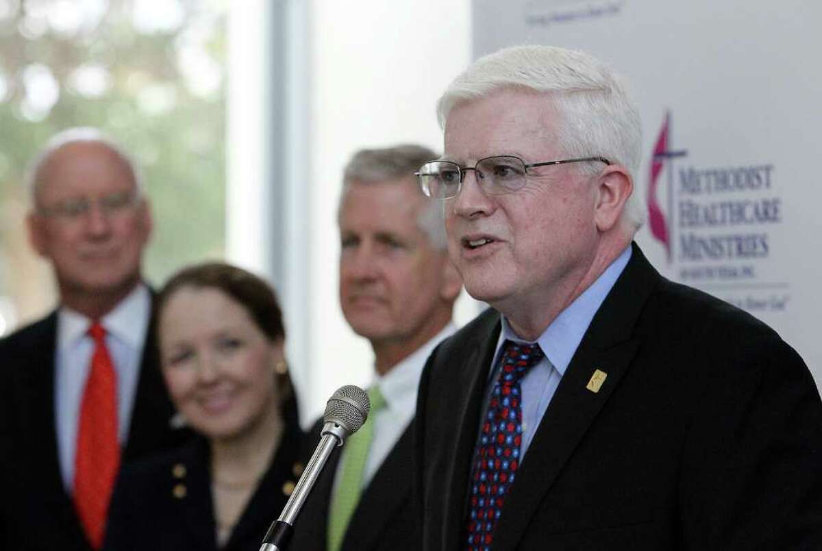 President and CEO of Methodist Healthcare Ministries Kevin Moriarty (right) makes an announcement about a $10 million gift to several mental health facilities throughout the city to aid organizations that care for the indigent and the underserved on Wednesday, Oct. 12, 2011. The announcement was in front an audience including his executive management team and members of the organizations who will receive the donation.