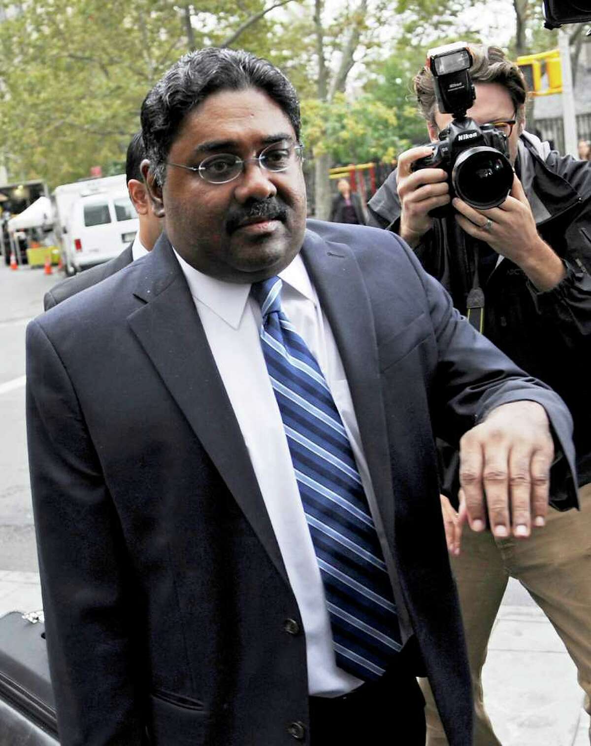 Raj Rajaratnam, co-founder of Galleon Group LLC, enters federal court in New York, U.S., on Thursday, Oct. 13, 2011. Rajaratnam was sentenced to 11 years in prison and a $10 million fine for conspiracy and securities fraud. Photographer: Peter Foley/Bloomberg *** Local Caption *** Raj Rajaratnam
