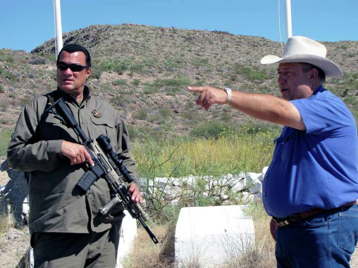 Sheriff Arvin West gestures while talking to Steven Seagal, who is due to start his job as “deputy chief to the chief deputy” in the Hudspeth County Sheriff’s Office early next year.