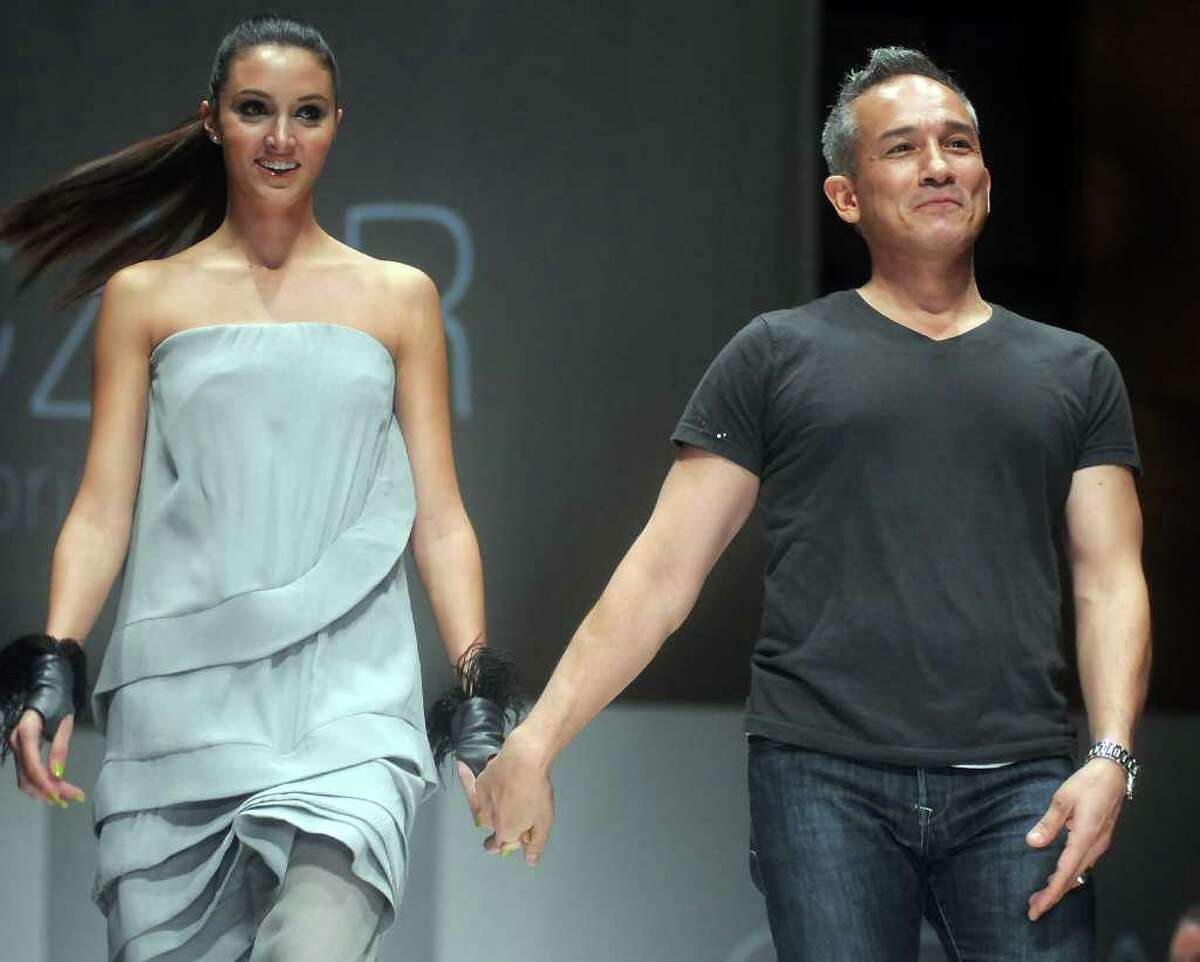 Designer Cesar Galindo with model Katelyn Denney after his show at the second night of Fashion Houston at the Wortham Theater Monday Oct. 10,2011.(Dave Rossman/For the Chronicle)