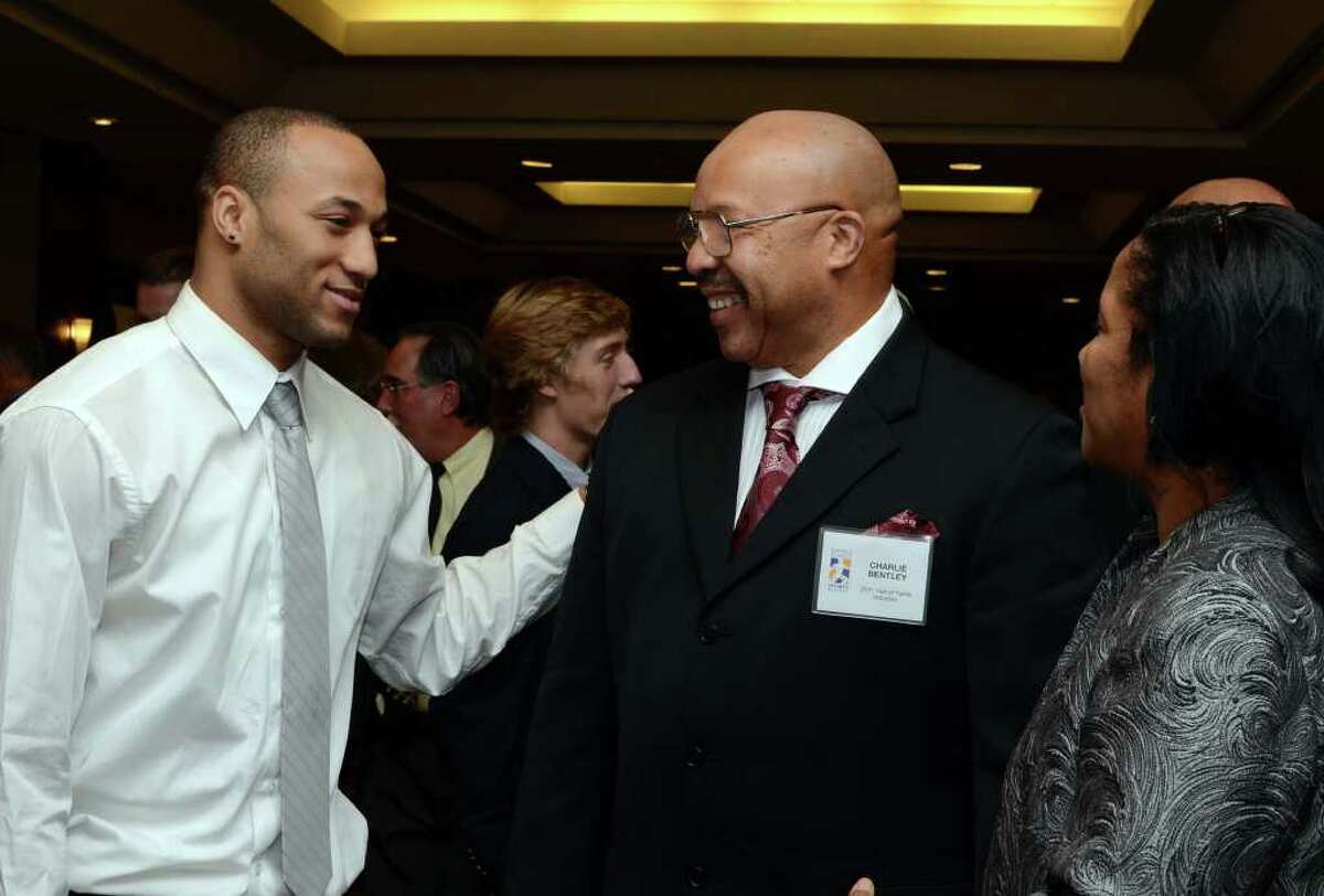 Charoy Bentley, at left, speaks with his father, Hall of Fame inductee, Charlie Bentley during the Fairfield County Hall of Fame dinner at the Greenwich Hyatt Regency on Monday, Oct. 17, 2011.