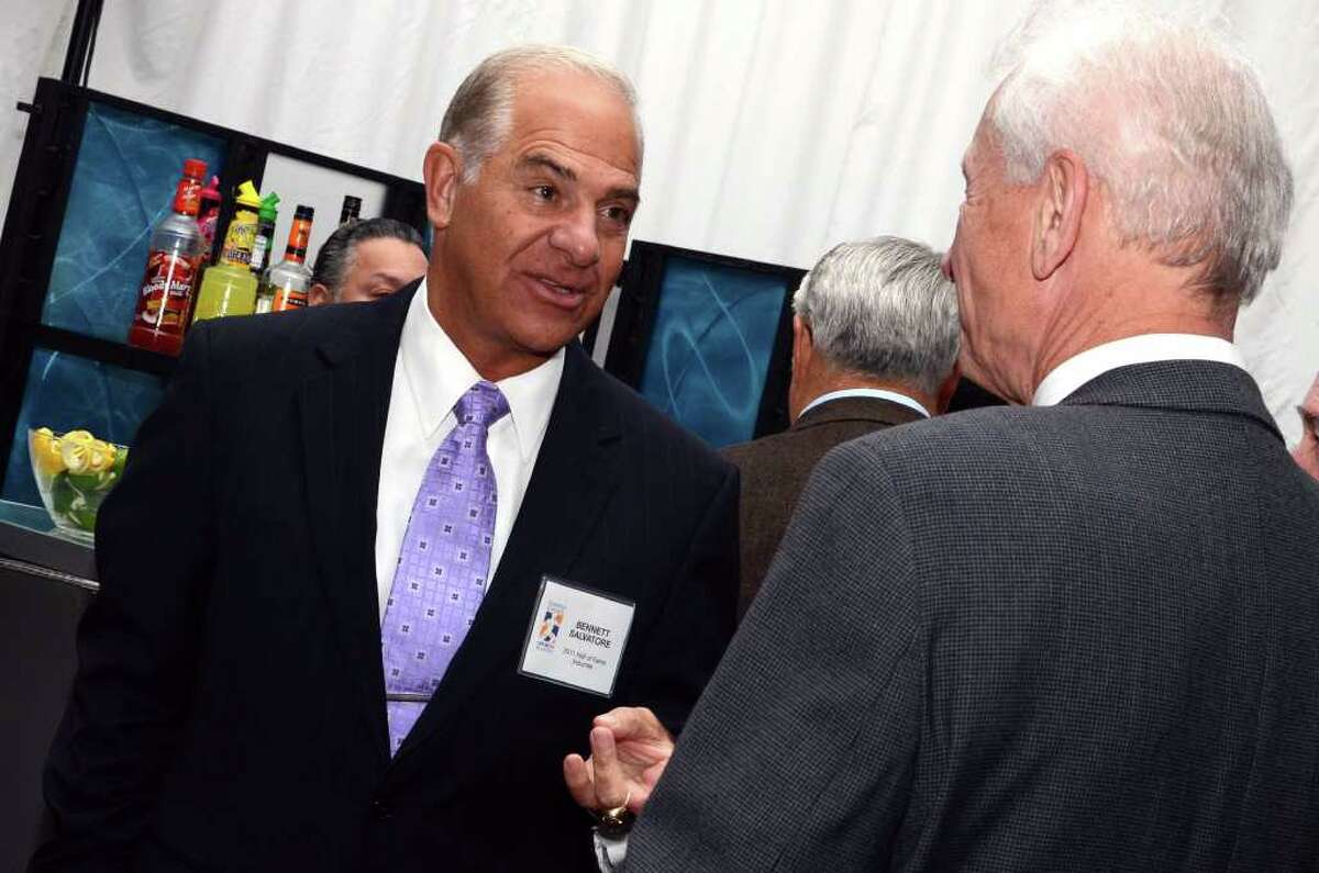 Hall of Fame inductee Bennett Salvatore chats with board member Terry O'Connor during the Fairfield County Hall of Fame dinner at the Greenwich Hyatt Regency on Monday, Oct. 17, 2011.