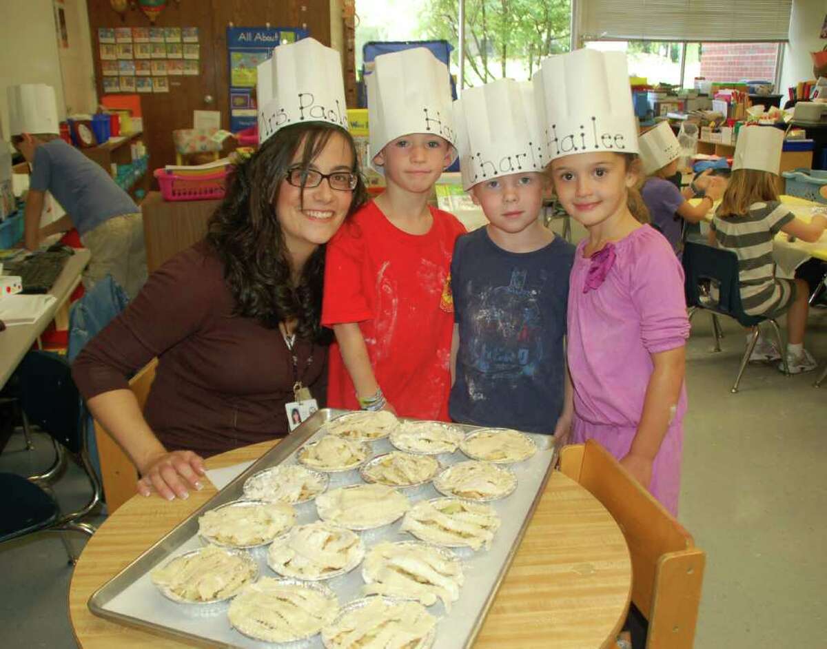 Showing off their baking creations are, from left, Helena Paolozzi, Hayden Shea, Charlie Schwind, and Hailee Giordano.