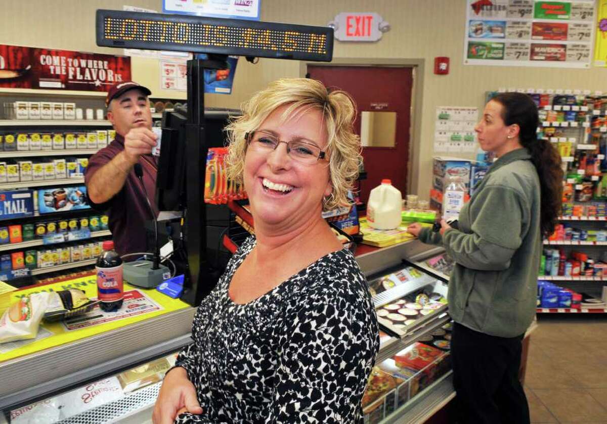 Regular customer Michelle Griffin of Schoharie at the register of the new Stewart's store in Schoharie as it opens for business Wednesday Oct. 19, 2011. (John Carl D'Annibale / Times Union)