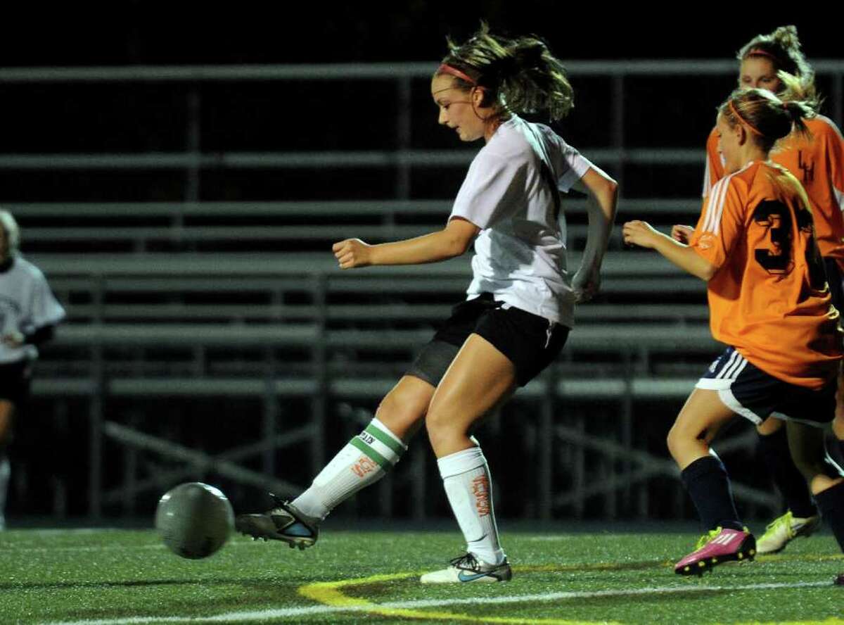 Shelton's #11 Angie Ferro passes the ball, during girls soccer action against Lyman Hall.